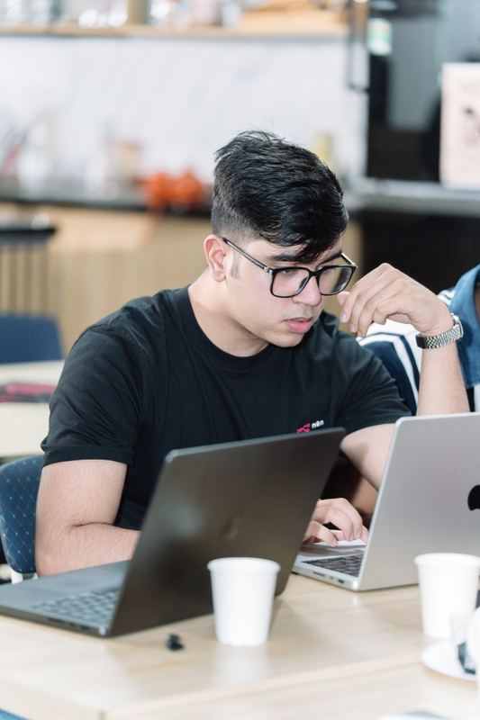 Anshul at his laptop during the hackathon