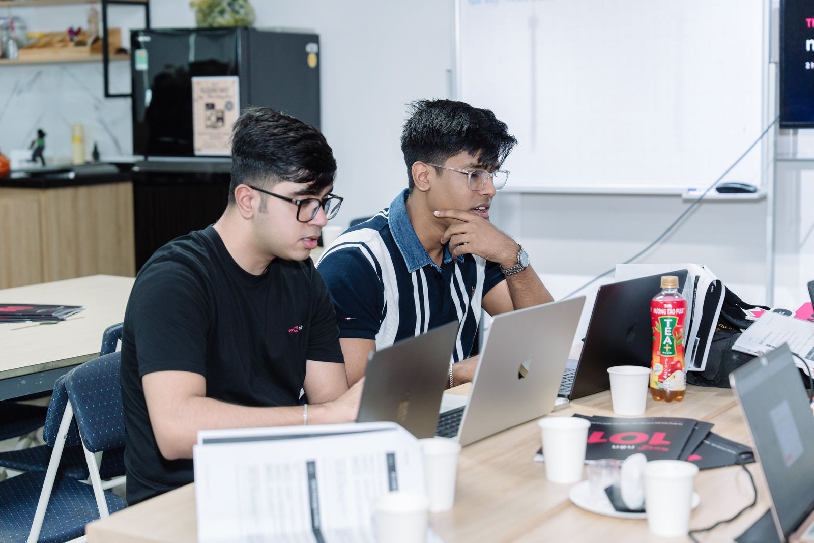 Anshul working through a build with a teammate